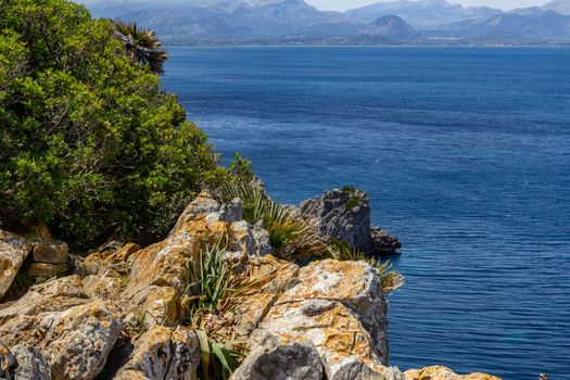 Bay on the peninsula La Victoria, Mallorca with rock in the water and rocky coastline