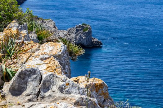 Bay on the peninsula La Victoria, Mallorca with rock in the water and rocky coastline