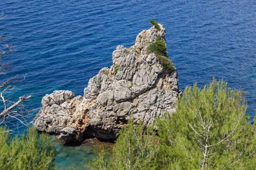 Bay on the peninsula La Victoria, Mallorca with rock in the water and rocky coastline