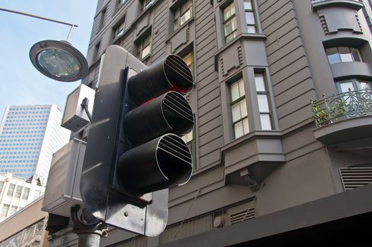 Traffic light with red colour light on in European town