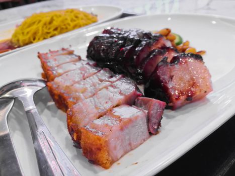 Roasted pork and BBQ pork Chinese style on white plate