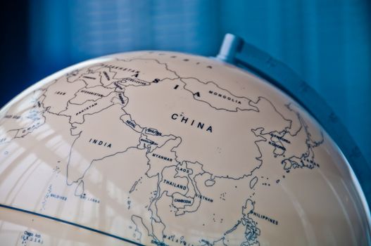 China India and South East Asia countries map in a retro old classic vintage Earth globe in executive management board room