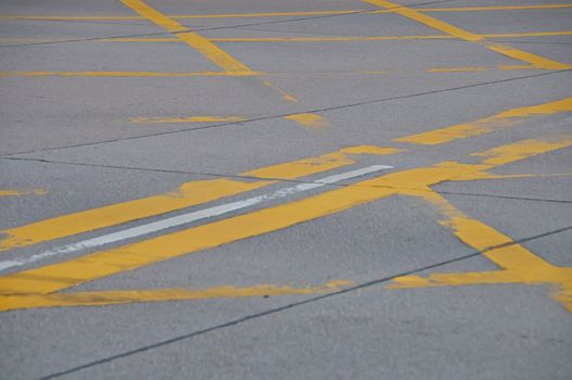 Abstract yellow painted traffic line pattern on concrete road street background