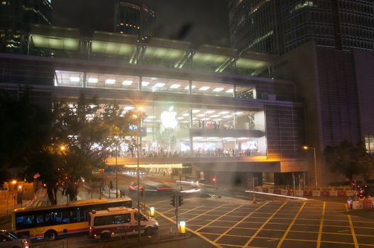 HONG KONG, HONG KONG SAR - NOVEMBER 17, 2018: Bright shiny Apple store in Central Hong Kong at night. There are many people inside the store.