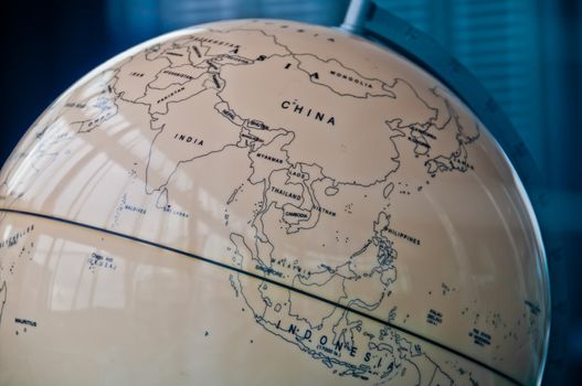 China India and South East Asia countries map in a retro old classic vintage Earth globe in executive management board room