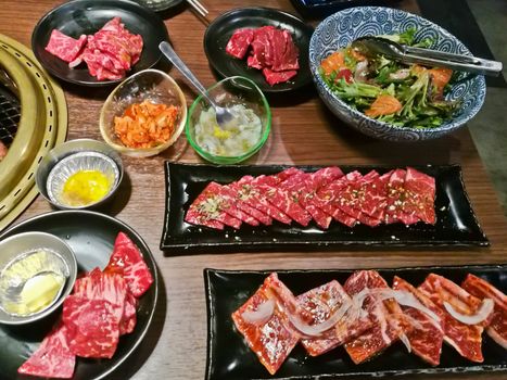 Various premium Japanese Wagyu marbling grilled beef yakiniku fire pot in Tokyo Japan