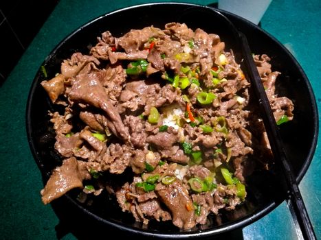 Premium stir fried spicy Wagyu beef sliced tongue on rice Japanese style