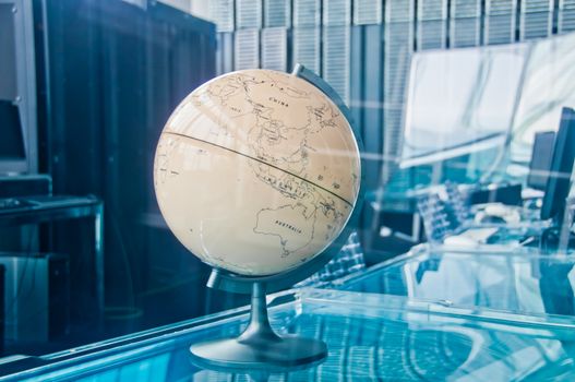 Vintage old classical retro Earth Globe model in a business strategy operation board executive management room