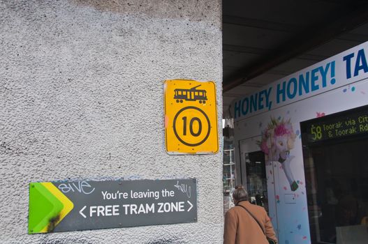 MELBOURNE, AUSTRALIA - JULY 30, 2018: Sign end of free tram zone in Melbourne Victoria Australia with tram no. 58