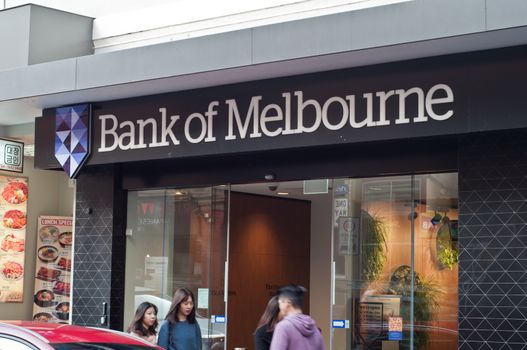 MELBOURNE, AUSTRALIA - JULY 26, 2018: People walk in front of Bank of Melbourne in China town branch in Melbourne Australia