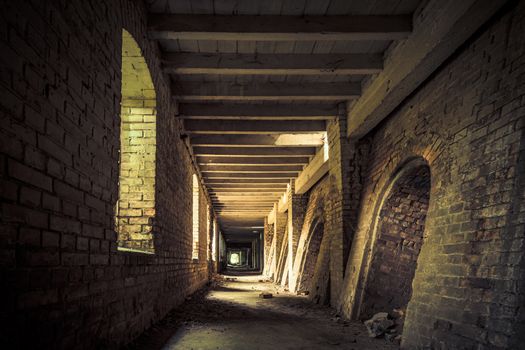 Urban exploring in an old abandoned brick factory, a lost place with ancient history, vandalism and graffiti