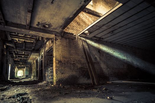 Urban exploring in an old abandoned brick factory, a lost place with ancient history, vandalism and graffiti