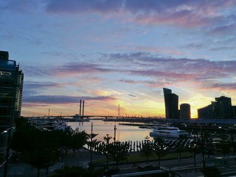 MELBOURNE, AUSTRALIA - JULY 26, 2018: Sunset panorama scene of docklands marina harbour in Melbourne Victoria Australia