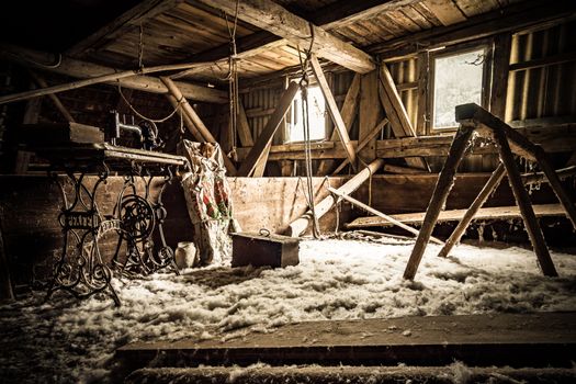 Urban exploring in an old abandoned farm house, a lost place with dirty furniture and dusty paintings