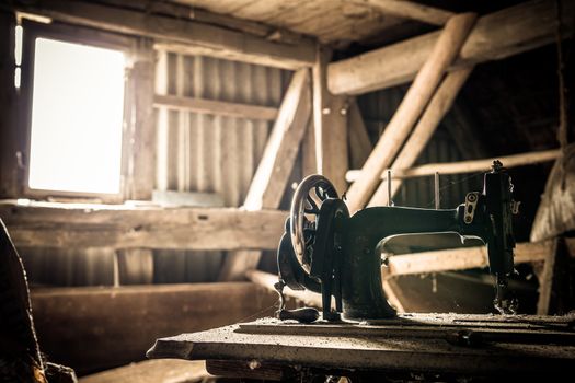 Urban exploring in an old abandoned farm house, a lost place with dirty furniture and dusty paintings