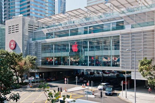 HONG KONG, HONG KONG SAR - NOVEMBER 30, 2018: Bright shiny Apple store in Central Hong Kong at night. There are many people inside the store.