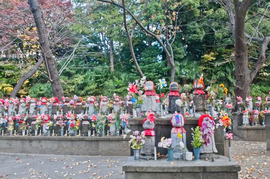 TOKYO, JAPAN - DECEMBER 1, 2018: Scene of wind turbine papers to worship souls of children in the back park of Zojo-ji Buddhist famous temple built from 1622. There is nobody in the photo.