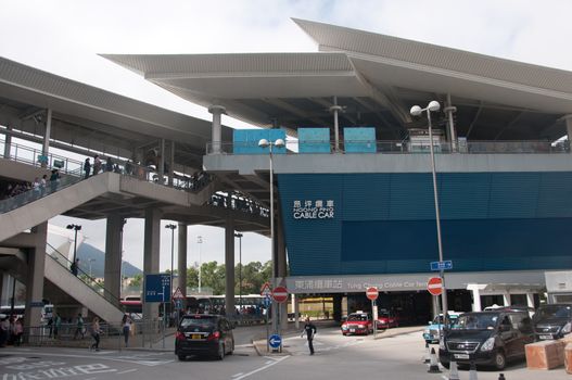 HONG KONG, HONG KONG SAR - NOVEMBER 18, 2018: Ngong Ping cable car station near Tung Chung area. There are many tourists walking upstairs to the station.