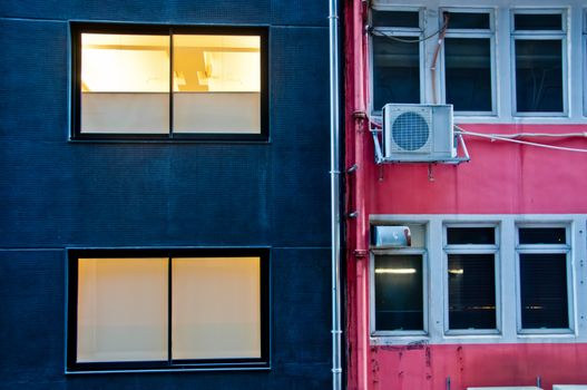 Contrast colour scene of blue and pink building walls in Hong Kong China SAR in the evening