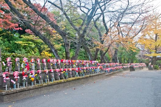 TOKYO, JAPAN - DECEMBER 1, 2018: Scene of wind turbine papers to worship souls of children in the back park of Zojo-ji Buddhist famous temple built from 1622. There is nobody in the photo.