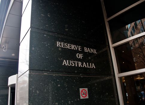 MELBOURNE, AUSTRALIA - JULY 26, 2018: Reserve Bank of Australia name on black granite wall in Melbourne Australia with a reflection of high-rise buildings. The RBA building is located at 60 Collins St, Melbourne VIC 3000 Australia.