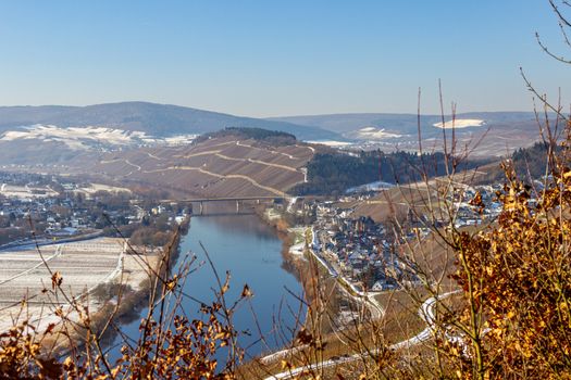 View on the valley of the river Moselle, Germany in winter with snow