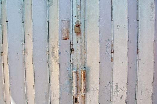 Old vintage classical metallic strong folding gate of front door of a house