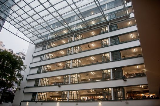 HONG KONG, HONG KONG SAR - NOVEMBER 17, 2018: Various shops in each floor of Queen’s College and Police Married Quarters (PMQ) in Central Hong Kong.