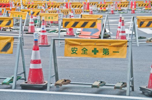 TOKYO, JAPAN - DECEMBER 1, 2018: Temporary barricade with traffic management red cone near construction site in the center of Tokyo in the morning. Nobody is in the photo.