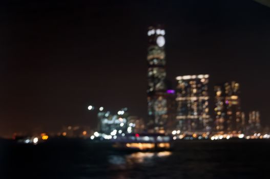 Defocused dark blurry scene of skyscrapers commercial towers in Hong Kong near Victoria Bay