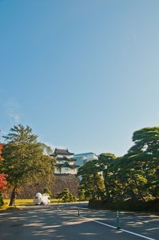 TOKYO, JAPAN - DECEMBER 1, 2018: Old Fortress inside Royal Japanese Imperial Palace. There is a News Reporter mobile broadcasting van parks on a road. There is nobody in the photo.