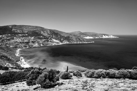 Rocky coast and sandy beach on the island of Kefalonia in Greece, monochrome