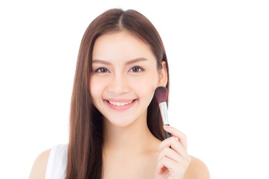 Beauty asian woman applying make up with brush of cheek isolated on white background, beautiful of girl holding blusher, skincare and cosmetic concept.