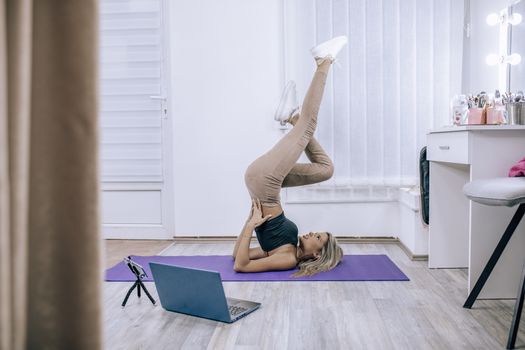 Fitness Yoga coaching working from home - Personal training online stock photo