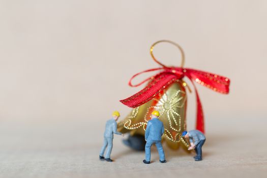 Miniature people,  Worker team working with a Christmas decoration , Christmas and Happy New Year concept.