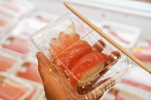 Famous fresh raw Japanese tuna in a box. There are the red meat, medium fatty, full fatty tuna sushi.