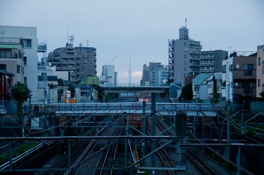 Morning sun rise scene of Tokyo metropolis and complex train tracks