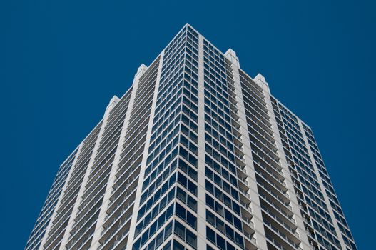 Generic corporate office building with blue sky