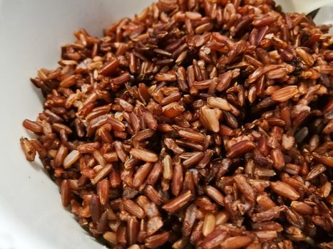 Dark red brown organic Thai rice in a bowl