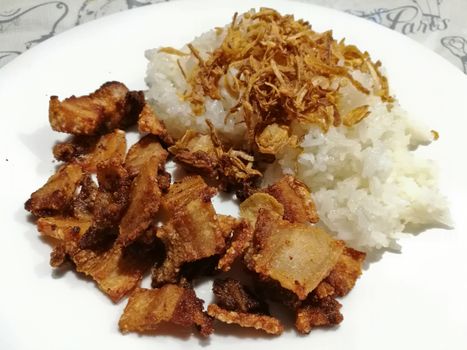 Crispy deep fried prok Thai style with sticky rice