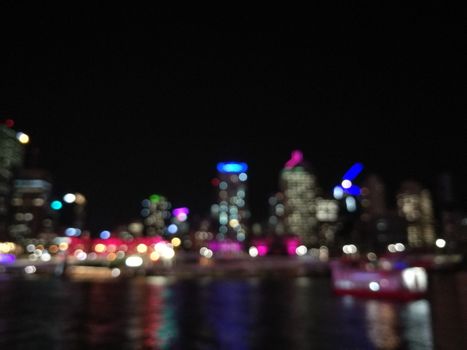 Defocused scene of night light from Brisbane Australia riverbank city scape scene