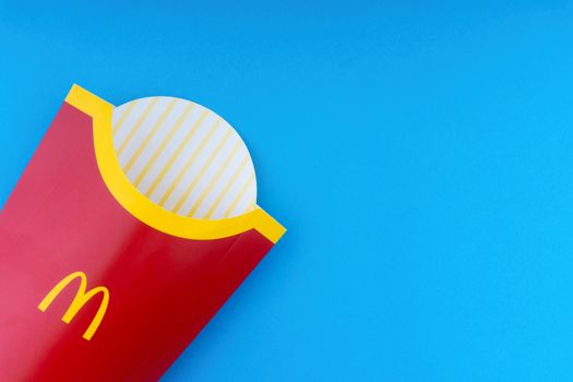 Kuala Lumpur, Malaysia - October 19, 2020 : McDonalds French fries  box on blue background