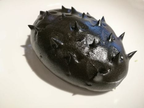 Black sea cucumber Chinese fusion bao bun snack on white background