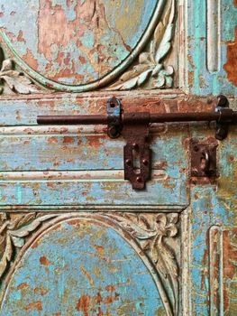 Morroccan vintage metal lock key on blue old door