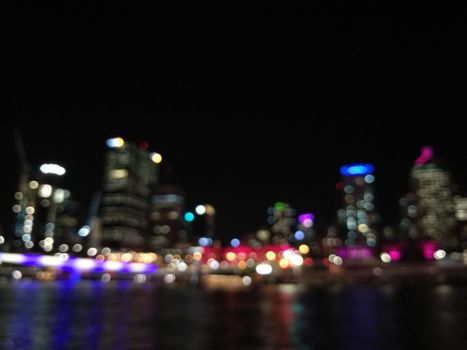 Defocused scene of night light from Brisbane Australia riverbank city scape scene