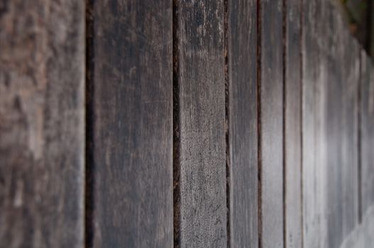 Selective focus on brown wooden plank board background