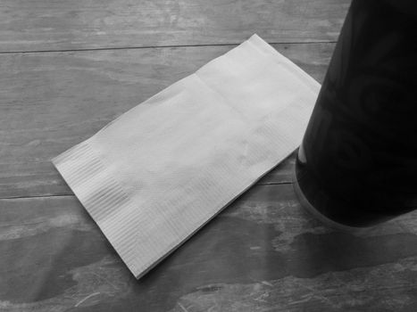White tissue paper with black cold iced coffee in black and white