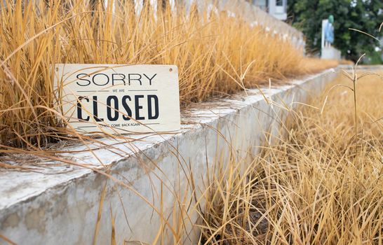 Sorry we're closed sign on an abandoned business establishment. Places temporarily closed during coronavirus pandemic.