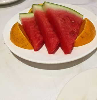 Fresh fruit water melon and mandarin on white plate