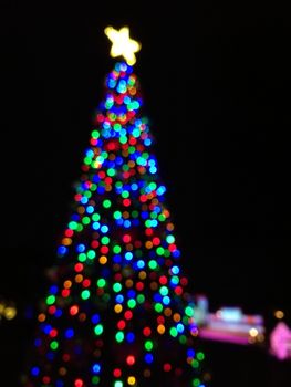 Defocused abstract light Christmas tree shape to celebrate Xmas and New Year Festival